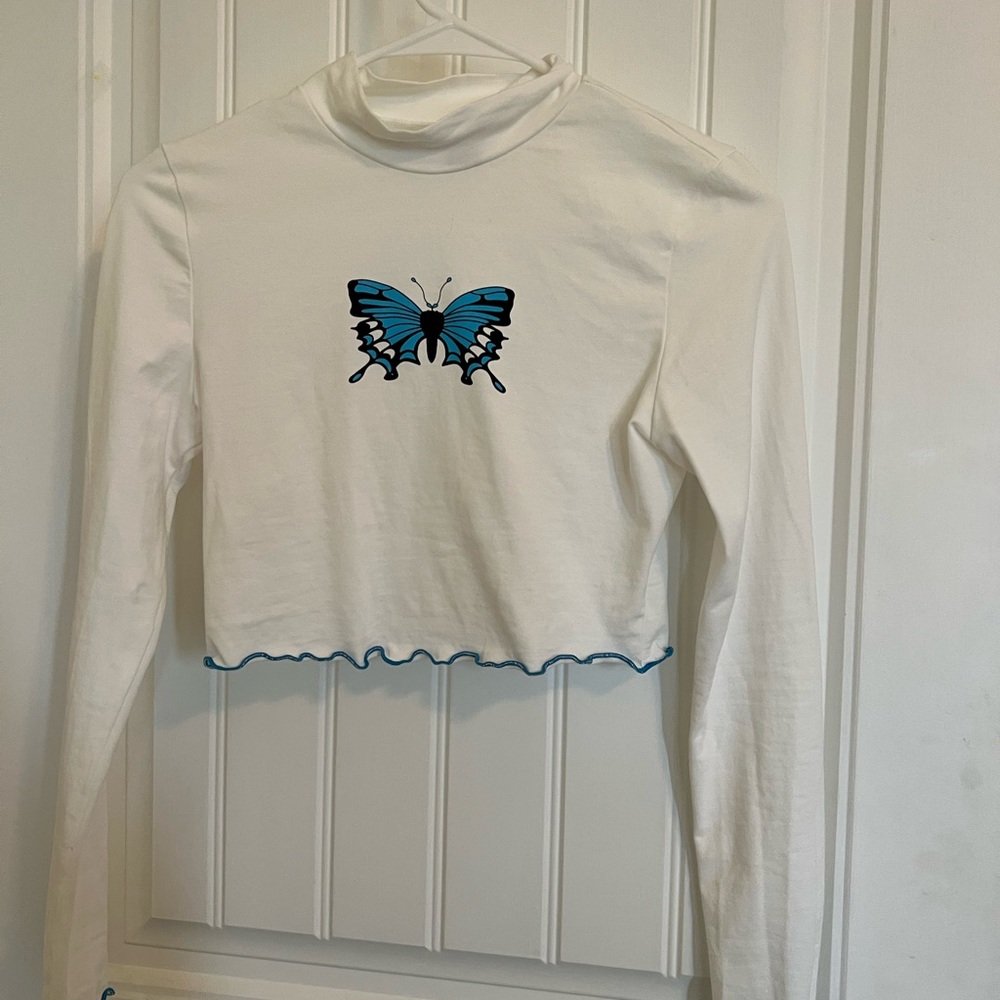Butterfly cropped turtle neck.